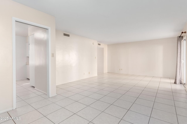 empty room with light tile patterned flooring