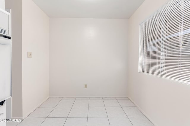 unfurnished room featuring light tile patterned floors