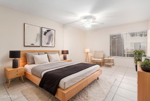 bedroom featuring light tile patterned floors and ceiling fan