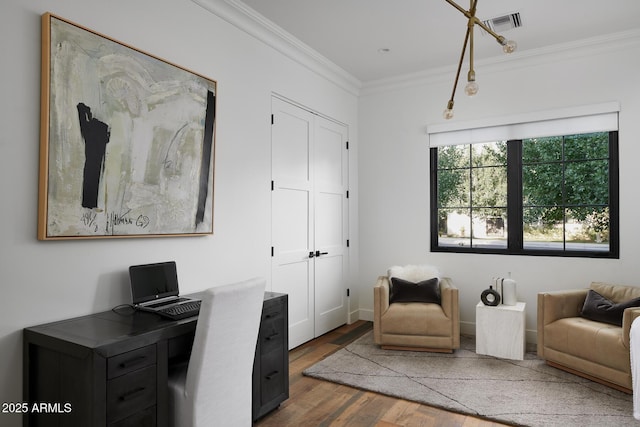 home office with dark wood-type flooring and ornamental molding