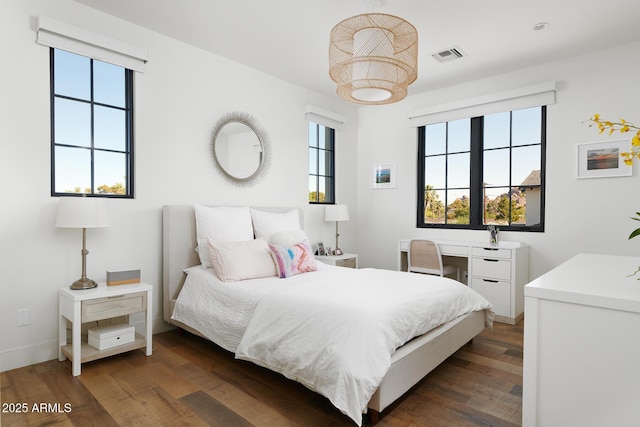 bedroom featuring dark hardwood / wood-style flooring