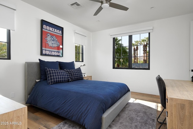 bedroom featuring ceiling fan and dark hardwood / wood-style flooring