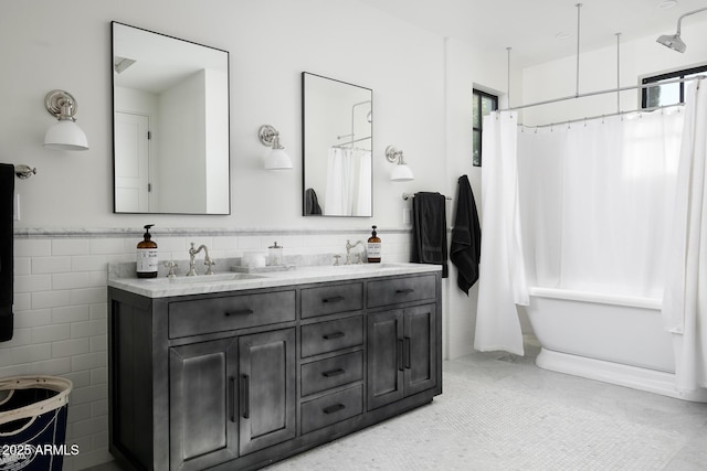 bathroom featuring tile walls, tile patterned flooring, and vanity