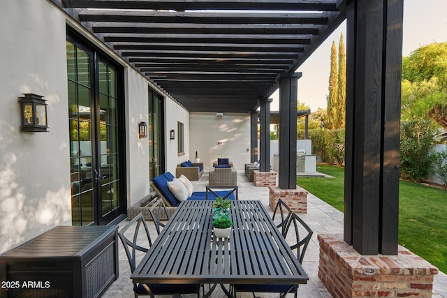 view of patio / terrace featuring an outdoor kitchen, a pergola, and outdoor lounge area