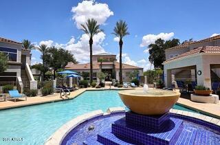11375 E Sahuaro Dr Unit 2064, Scottsdale, AZ 85259 - view of pool featuring a pool with connected hot tub and a patio area