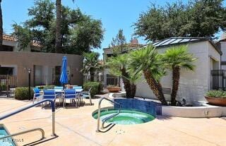 11375 E Sahuaro Dr Unit 2064, Scottsdale, AZ 85259 - view of swimming pool featuring a hot tub and a patio