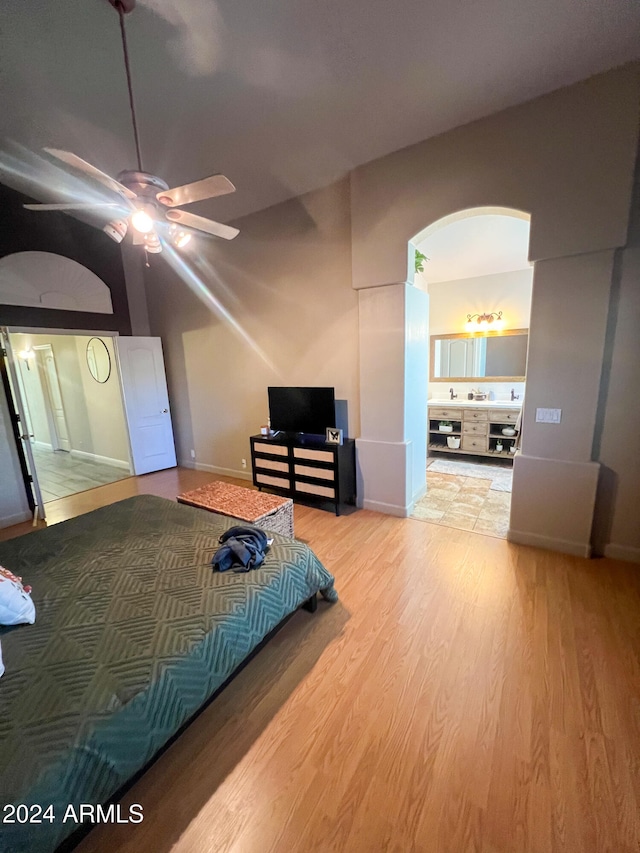 bedroom with ceiling fan and light wood-type flooring