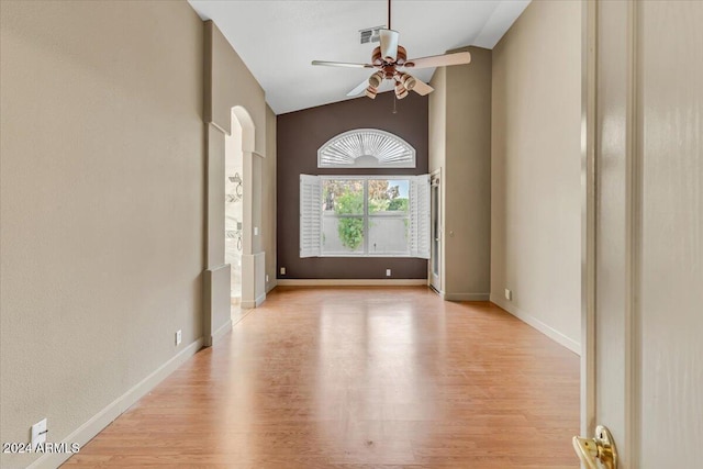 entrance foyer with ceiling fan, light hardwood / wood-style flooring, and high vaulted ceiling