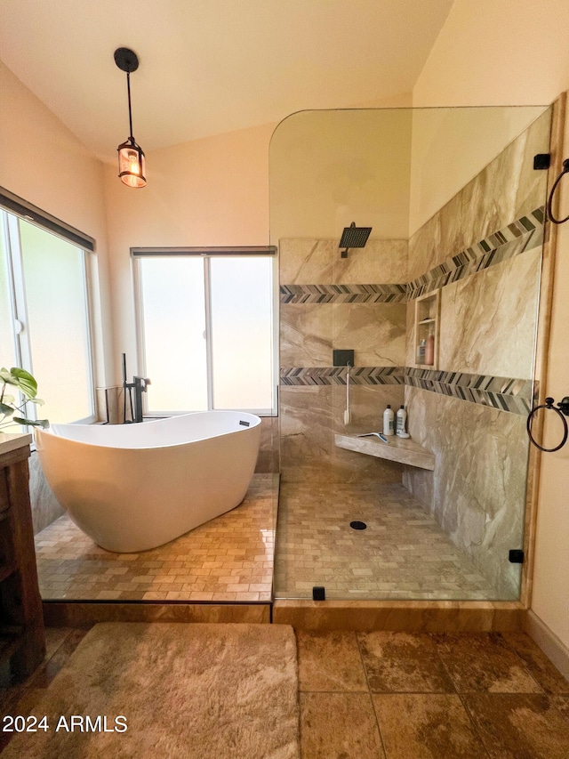 bathroom featuring tile patterned floors and independent shower and bath