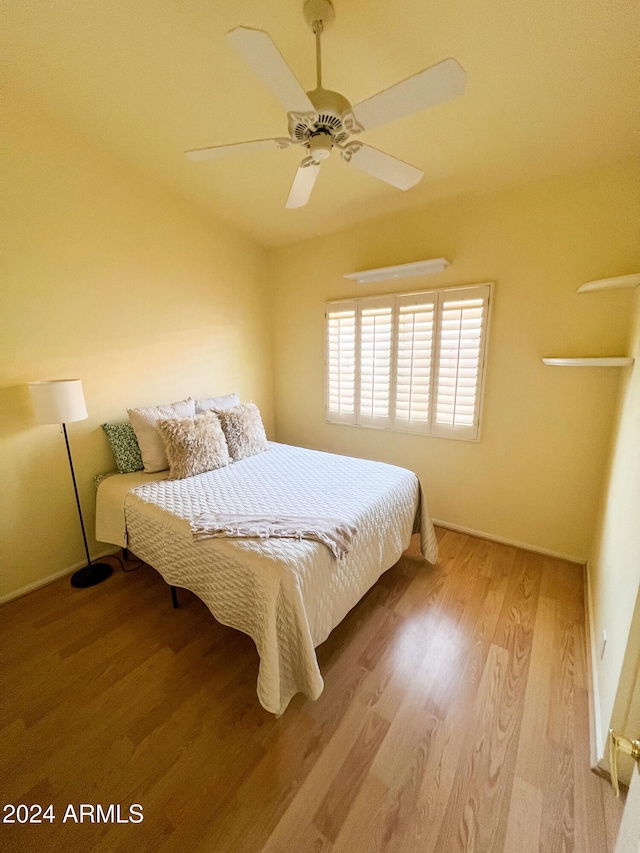 bedroom featuring ceiling fan and light wood-type flooring