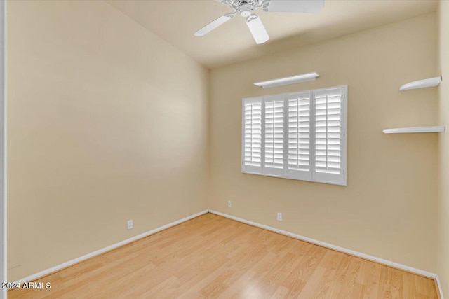 spare room with ceiling fan and hardwood / wood-style floors