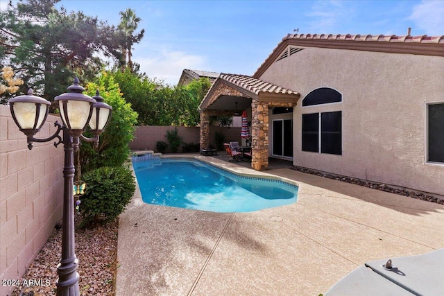 view of pool featuring a patio