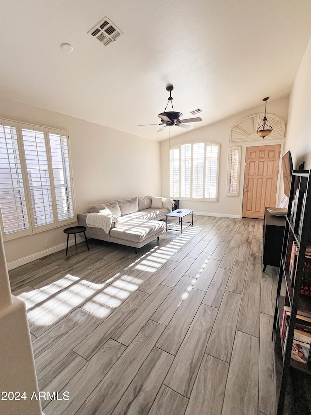 living room with ceiling fan and light hardwood / wood-style floors