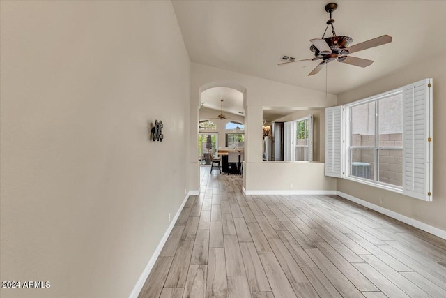 interior space featuring vaulted ceiling, ceiling fan, and light hardwood / wood-style flooring