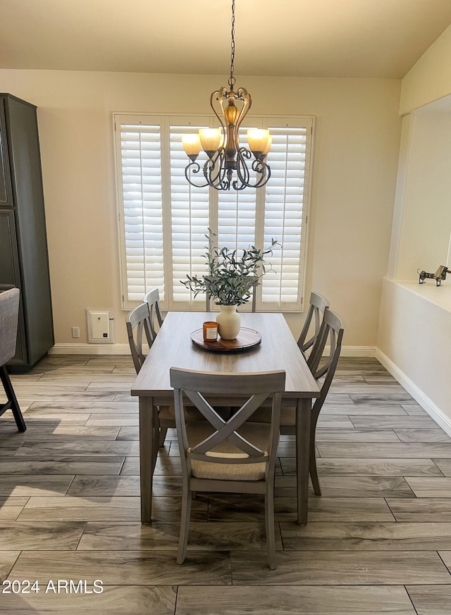 dining room with a chandelier and hardwood / wood-style floors