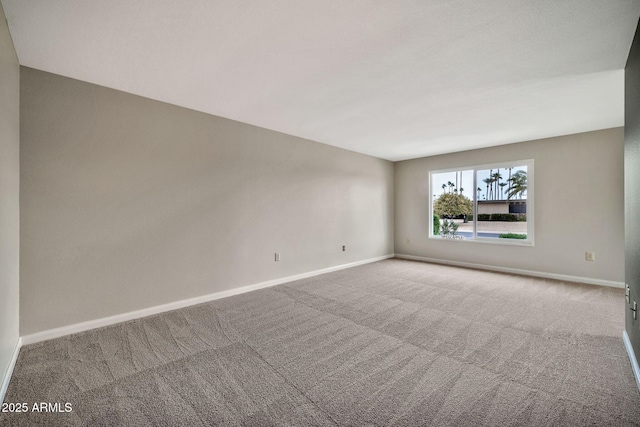 unfurnished room with light carpet