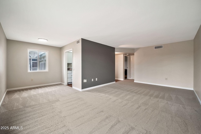 unfurnished room with carpet floors