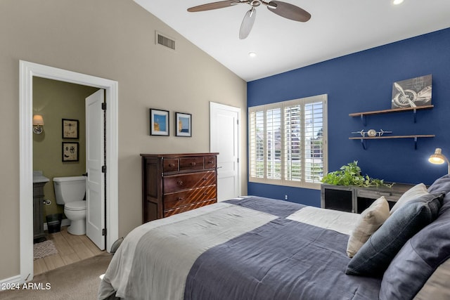 bedroom with carpet flooring, ensuite bathroom, ceiling fan, and lofted ceiling