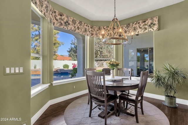 dining space featuring a chandelier, hardwood / wood-style floors, and a healthy amount of sunlight