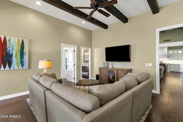 living room featuring beam ceiling, ceiling fan, and dark hardwood / wood-style flooring