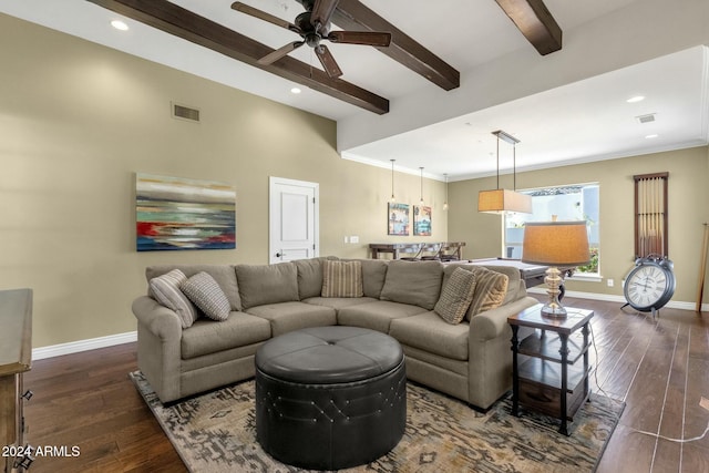 living room with beam ceiling, dark hardwood / wood-style floors, ceiling fan, and ornamental molding