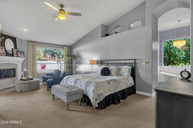 bedroom with light carpet, high vaulted ceiling, and ceiling fan