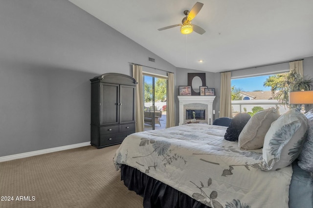 bedroom with multiple windows, ceiling fan, lofted ceiling, and access to exterior