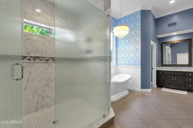 bathroom with ornamental molding, vanity, and independent shower and bath