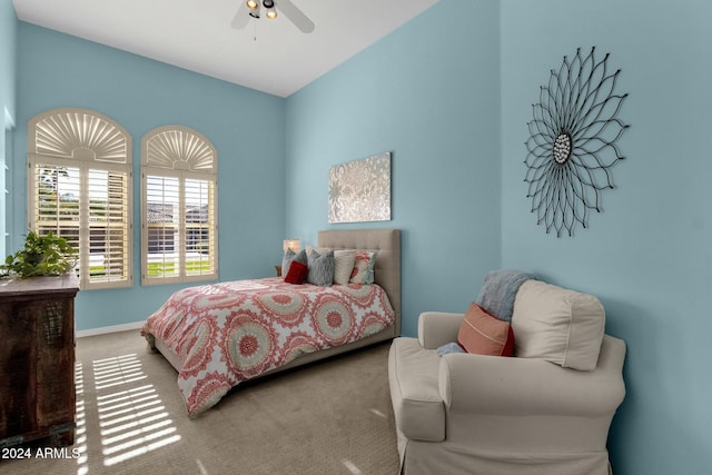 bedroom featuring ceiling fan and carpet