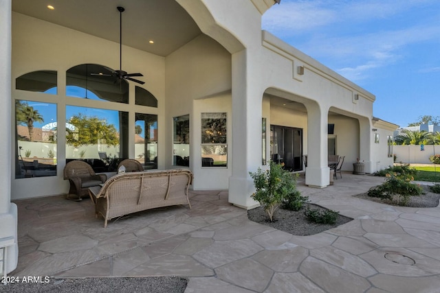 view of patio featuring ceiling fan