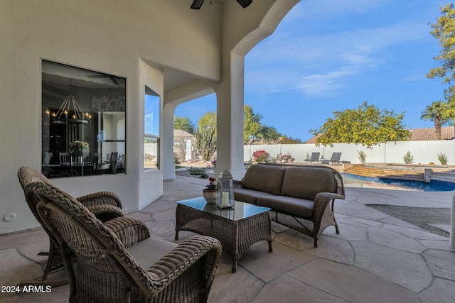 view of patio featuring an outdoor hangout area and a pool with hot tub