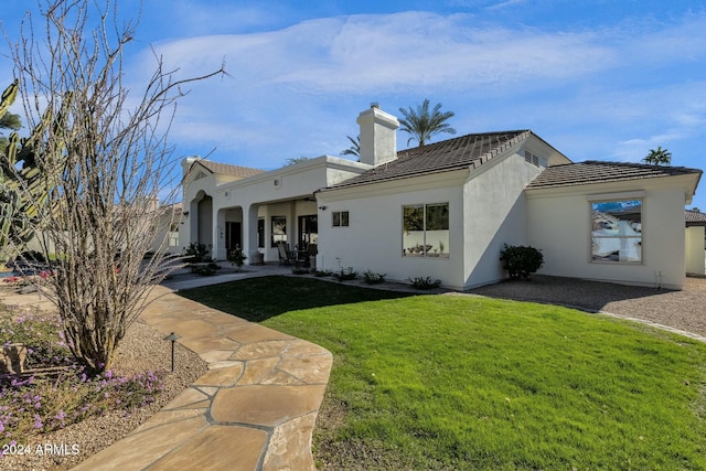 view of front of home with a front yard