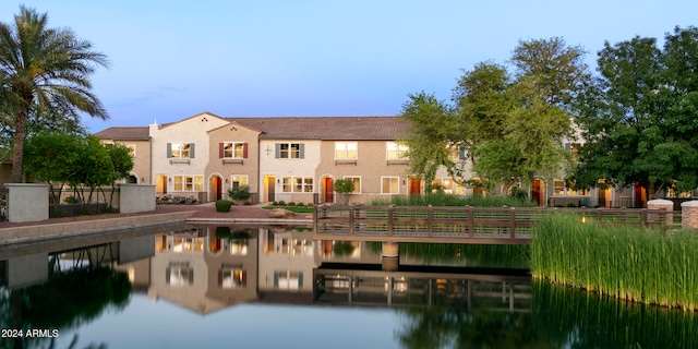 rear view of house with a water view