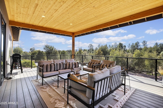 wooden terrace with outdoor lounge area