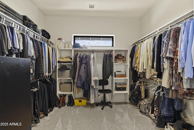 walk in closet featuring carpet flooring and visible vents