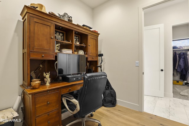 office area featuring baseboards