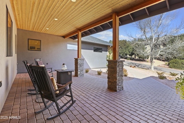 view of patio / terrace featuring an outdoor fire pit