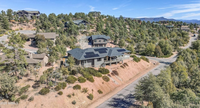 birds eye view of property with a mountain view