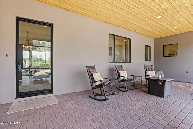 view of patio with a fire pit