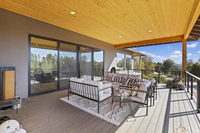 wooden terrace featuring outdoor lounge area