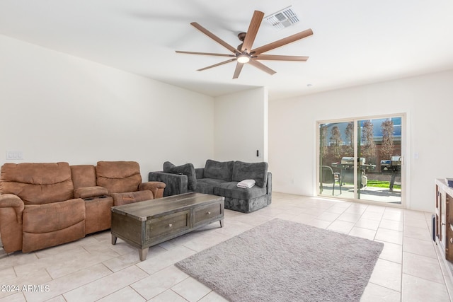 living area featuring ceiling fan, light tile patterned floors, and visible vents