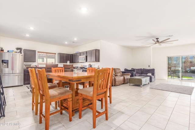 dining space with light tile patterned floors, visible vents, and recessed lighting