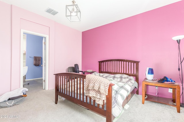 bedroom with visible vents and light colored carpet