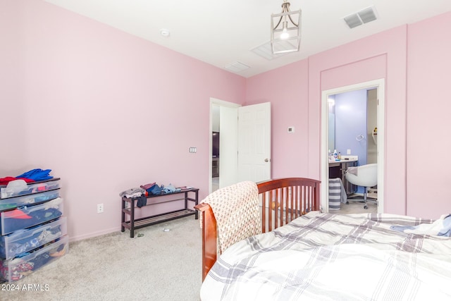 bedroom featuring visible vents and light carpet