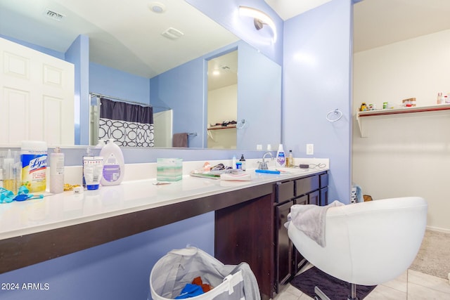 bathroom featuring a shower with shower curtain, tile patterned floors, visible vents, and vanity