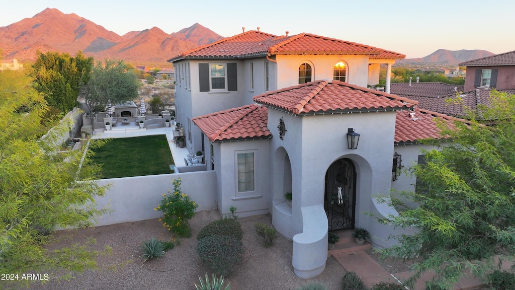 mediterranean / spanish house with a mountain view