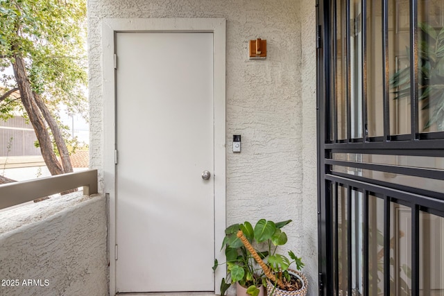 entrance to property with a balcony