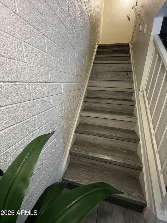 stairway with wood finished floors