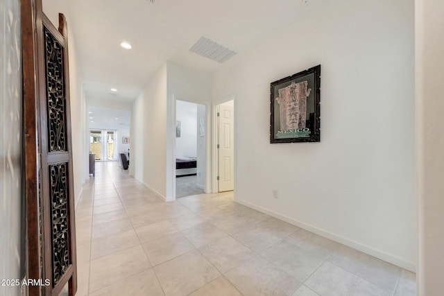 hallway with light tile patterned floors