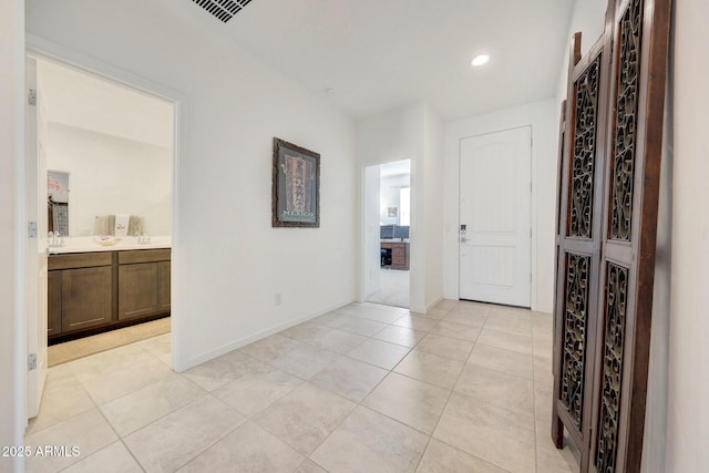 corridor with light tile patterned floors